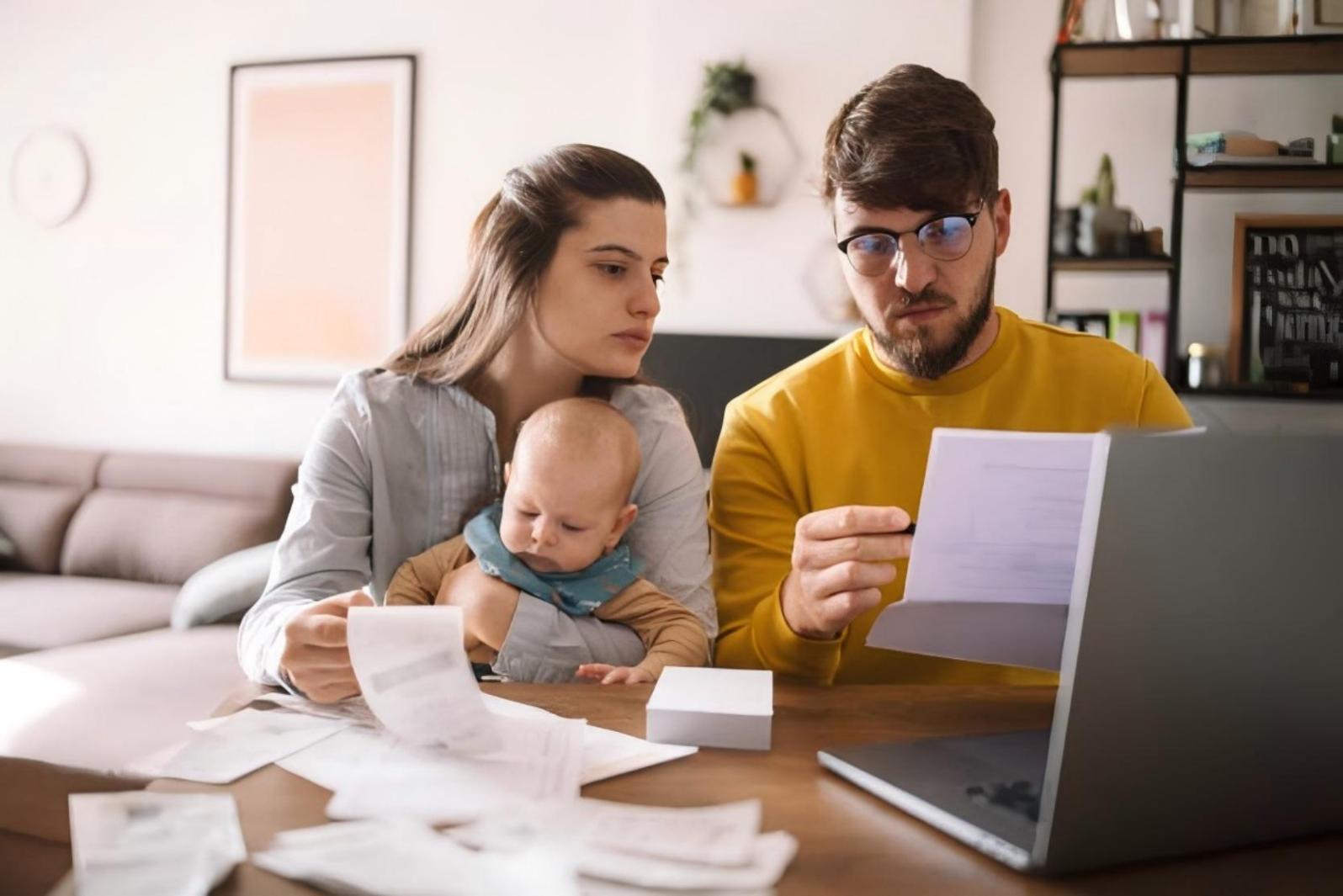 Family reviewing housing application documents and income paperwork